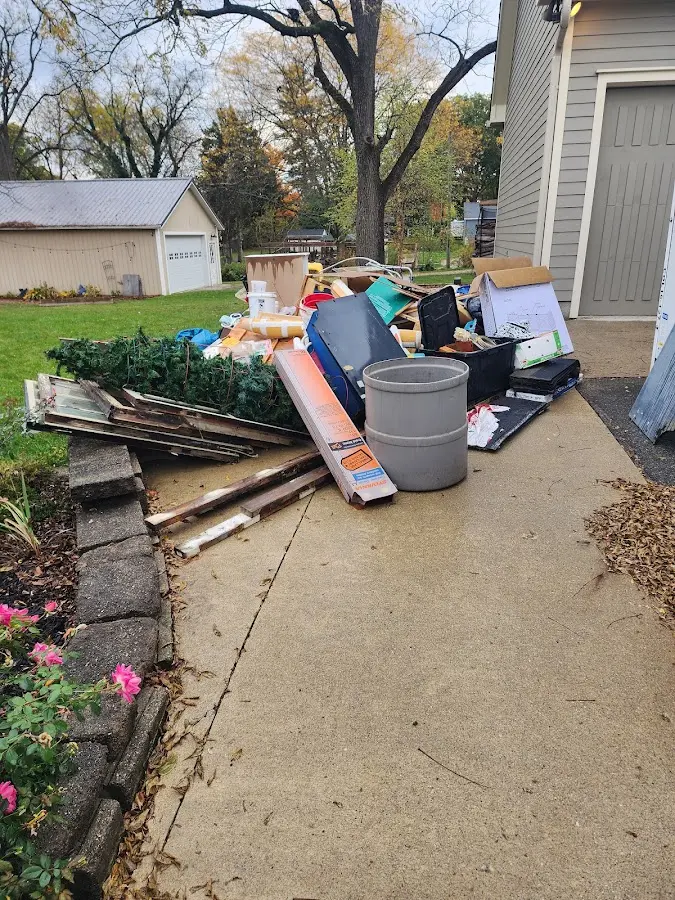 Dumpster being loaded with debris for 3 Yard Dumpster Rental in Mays Chapel